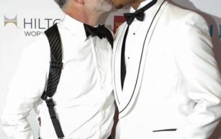Intergenerational Dating- 2 guys kissing. one older than the younger athelete