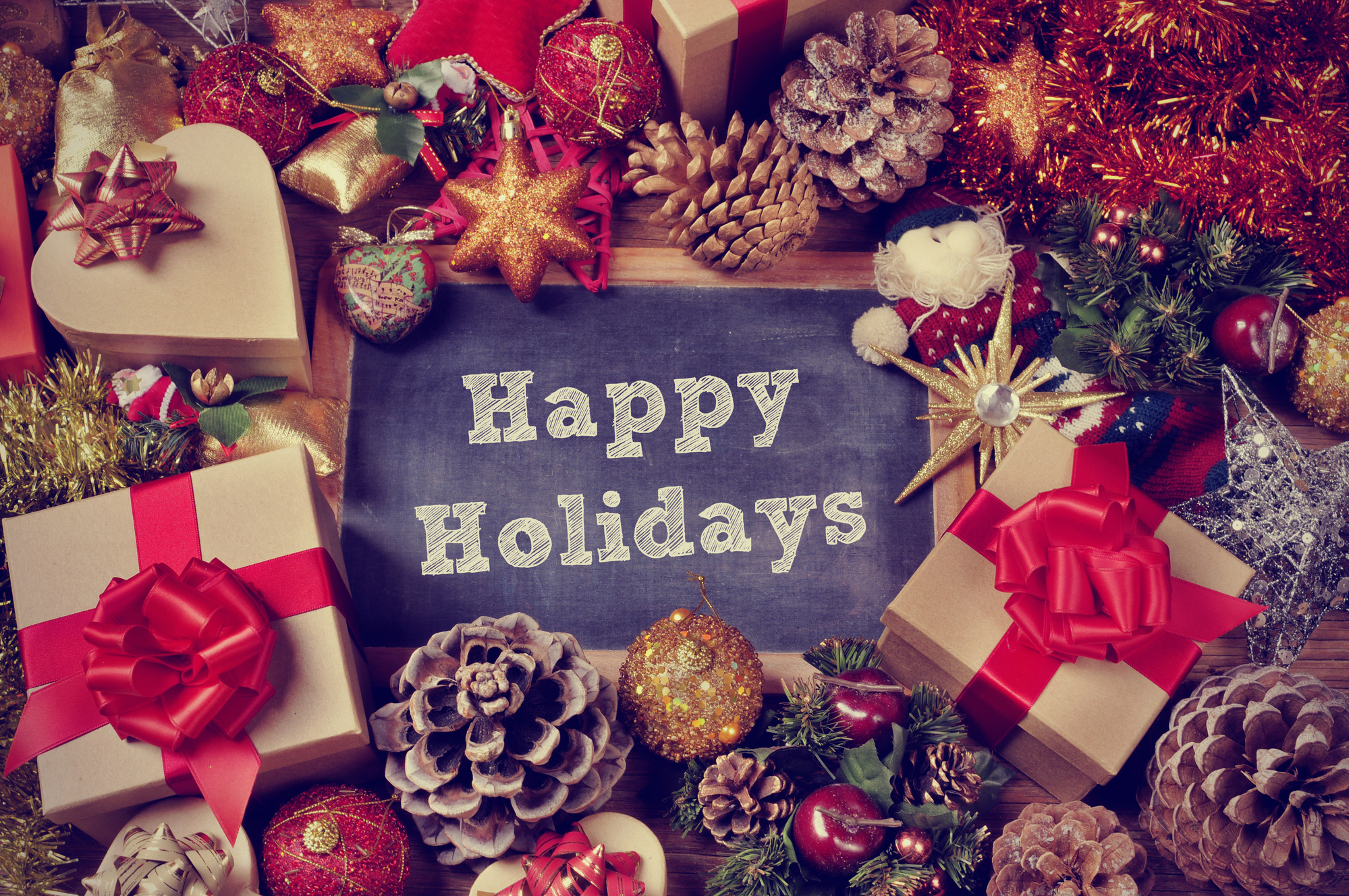gifts and christmas ornaments and the text happy holidays